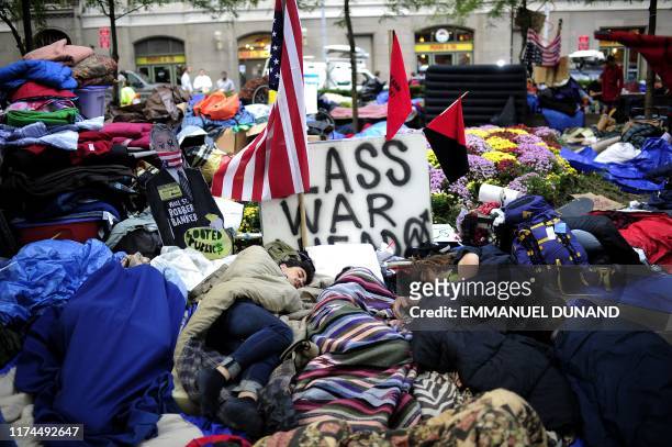 Members of Occupy Wall Street sleep, spending the night on Zuccotti Park near Wall Street in New York, October 11, 2011. Protesters from the Occupy...