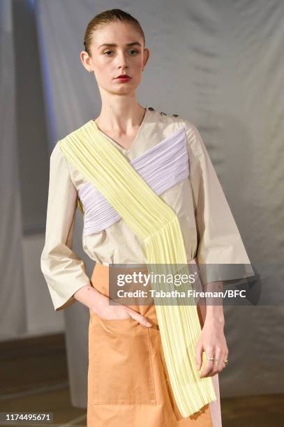 Model walks the runway at the Gayeon Lee show during London Fashion Week September 2019 at Foyles on September 13, 2019 in London, England.