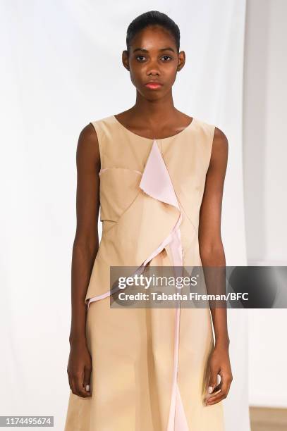 Model walks the runway at the Gayeon Lee show during London Fashion Week September 2019 at Foyles on September 13, 2019 in London, England.