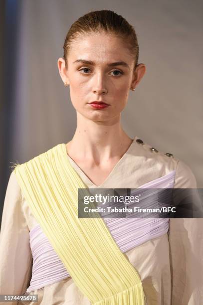 Model walks the runway at the Gayeon Lee show during London Fashion Week September 2019 at Foyles on September 13, 2019 in London, England.