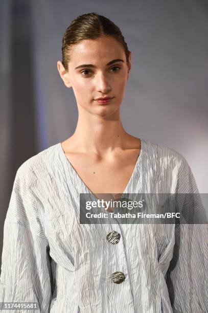 Model walks the runway at the Gayeon Lee show during London Fashion Week September 2019 at Foyles on September 13, 2019 in London, England.