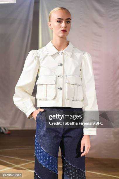 Model walks the runway at the Gayeon Lee show during London Fashion Week September 2019 at Foyles on September 13, 2019 in London, England.