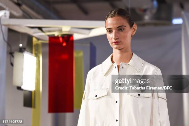 Model walks the runway at the Gayeon Lee show during London Fashion Week September 2019 at Foyles on September 13, 2019 in London, England.