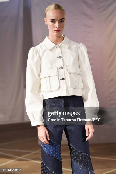Model walks the runway at the Gayeon Lee show during London Fashion Week September 2019 at Foyles on September 13, 2019 in London, England.