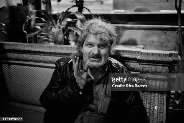 Portrait of American Beat poet Gregory Corso as he sits on a bench in the Chelsea Hotel, New York, New York, March 22, 1991.