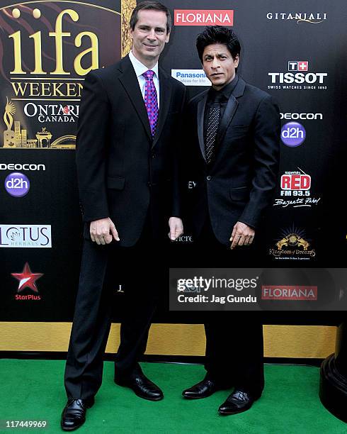 Actor Shah Rukh Khan and Dalton McGuinty attend the IIFA Awards green Carpet at the Rogers Centre on June 25, 2011 in Toronto, Canada.