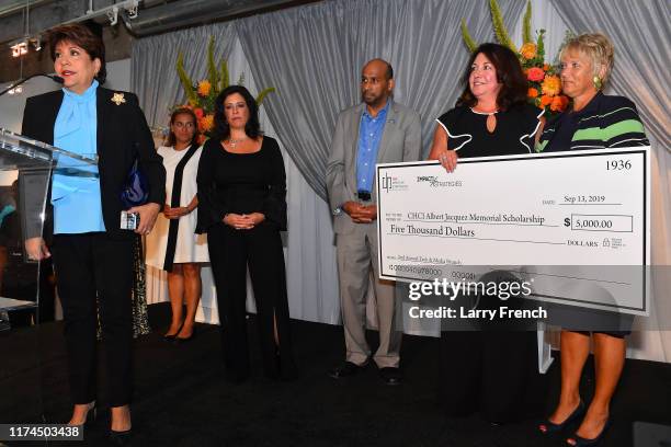 Janet Murguia presents the CHCI Albert Jacquez Memorial Scholarship check at IMPACT Strategies and D&P Creative Strategies 2nd Annual Tech & Media...