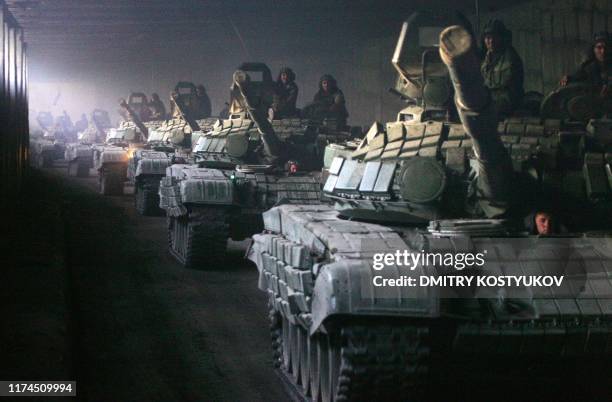 Column of Russian armoured vehicles moves towards the Roki tunnel on the border with Russia as they leave South Ossetia on August 23, 2008. Russian...