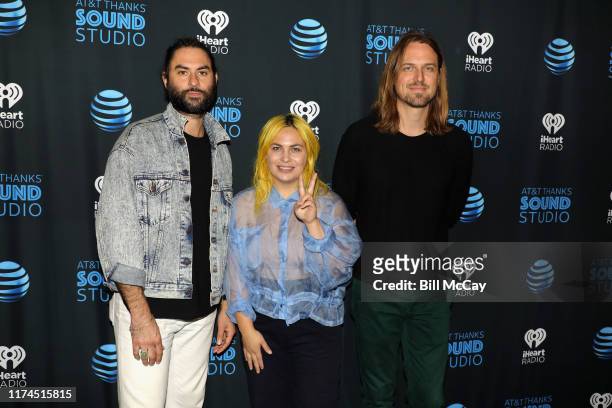 Josiah Johnson, Charity Rose Thielen and Jonathan Russell of The Head and the Heart pose at the Radio 104.5 Performance Theater October 8, 2019 in...