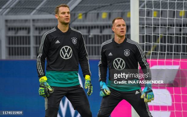Germany's goalkeeper Manuel Neuer and Germany's goalkeeper Marc-Andre Ter Stegen attend a training session of the German national football in...