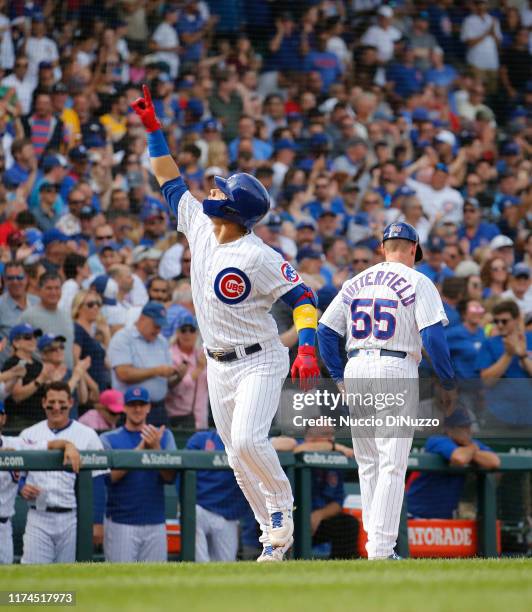 Willson Contreras of the Chicago Cubs celebrates his home run during the first inning of a game against the Pittsburgh Pirates at Wrigley Field on...