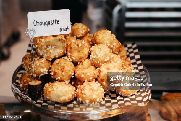 chouquette in a bakery. in a french bakery, store display. - chouquette stock pictures, royalty-free photos & images