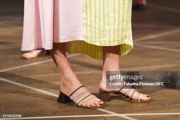 Model, shoe detail, walks the runway at the Gayeon Lee show during London Fashion Week September 2019 at Foyles on September 13, 2019 in London,...