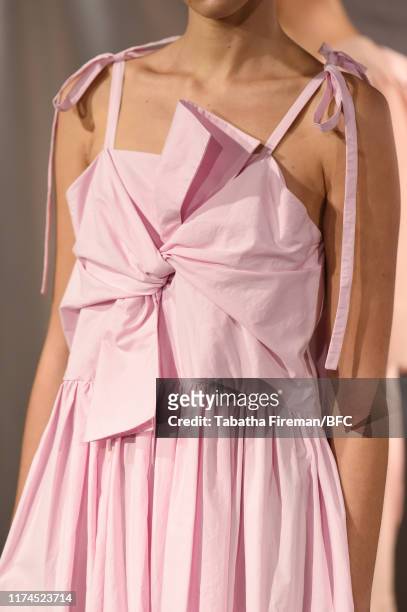 Model, detail, walks the runway at the Gayeon Lee show during London Fashion Week September 2019 at Foyles on September 13, 2019 in London, England.