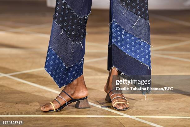 Model, shoe detail, walks the runway at the Gayeon Lee show during London Fashion Week September 2019 at Foyles on September 13, 2019 in London,...