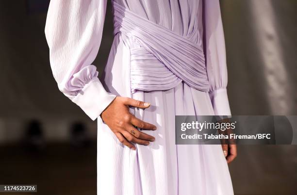 Model, detail, walks the runway at the Gayeon Lee show during London Fashion Week September 2019 at Foyles on September 13, 2019 in London, England.