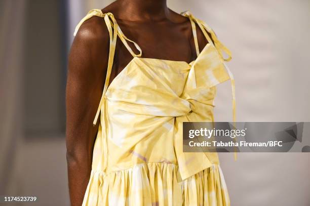 Model, detail, walks the runway at the Gayeon Lee show during London Fashion Week September 2019 at Foyles on September 13, 2019 in London, England.