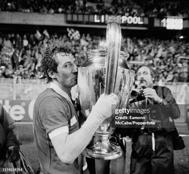 Alan Kennedy of Liverpool celebrates with the trophy after the 1981 European Cup Final between Liverpool and Real Madrid at the Parc des Princes on...