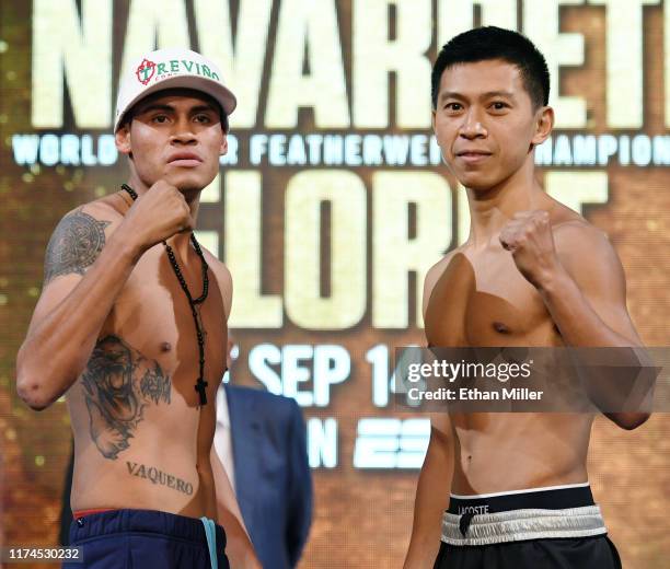 Super bantamweight champion Emanuel Navarrete and boxer Juan Miguel Elorde pose during a ceremonial weigh-in at the KA Theatre at MGM Grand Hotel &...