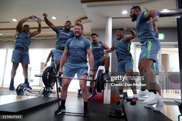 James Slipper of Australia is cheered on by his team mates as he competes in a weights challenge during a gym session on September 14, 2019 in...