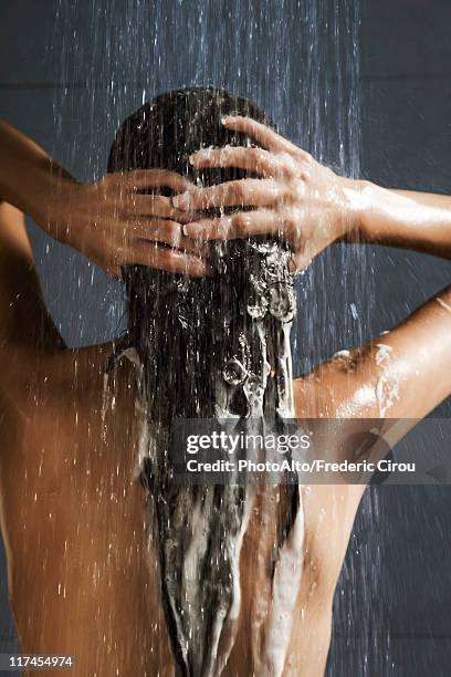 woman washing her hair in shower - shampoo bildbanksfoton och bilder