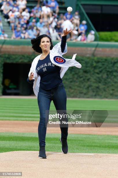 Actress Wendy Davis throws the ceremonial first pitch of the game between the Chicago Cubs and the Pittsburgh Pirates at Wrigley Field on September...