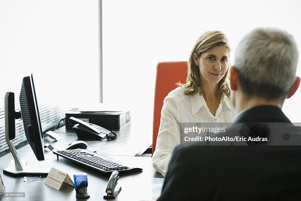 Businesswoman meeting with client in office