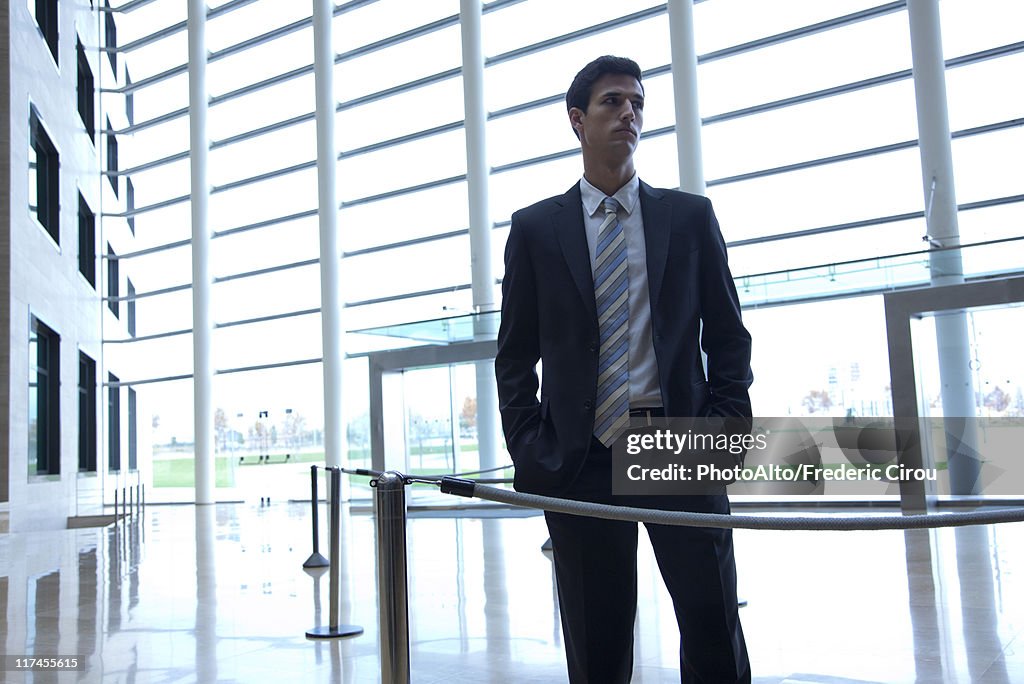 Businessman standing in lobby