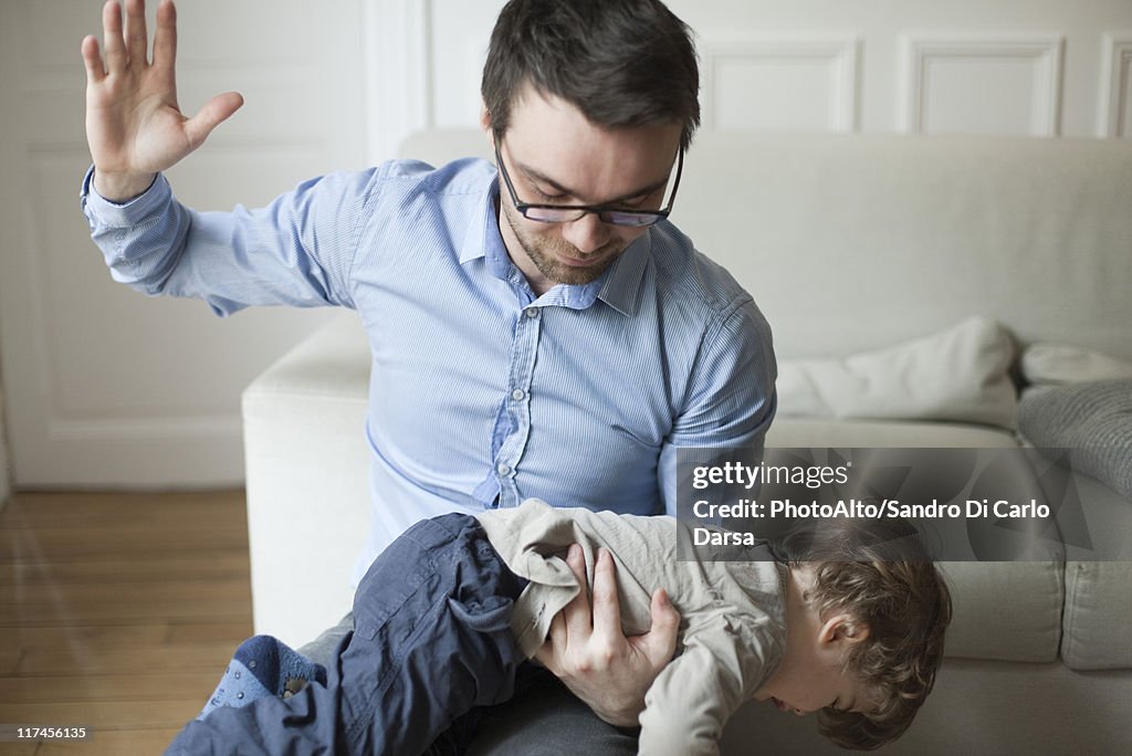 Father disciplining toddler