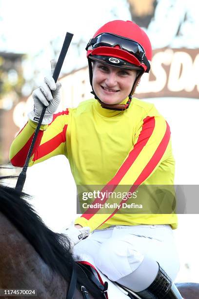 Jamie Kah celebrates after riding Gatting to win race 7 the Makybe Diva Stakes during Sofitel Girls' Day Out at Flemington Racecourse on September...