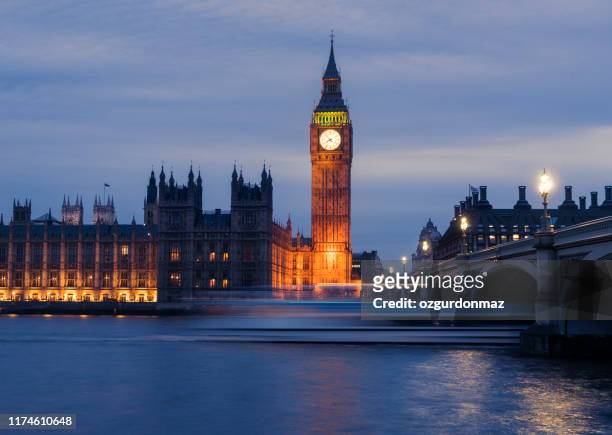 night shot of big ben and westminster bridge in london - london nightlife stock pictures, royalty-free photos & images