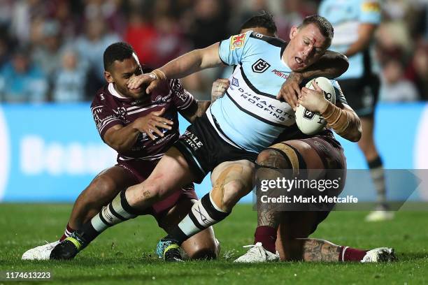 Paul Gallen of the Sharks Is tackled during the NRL Elimination Final match between the Manly Sea Eagles and the Cronulla Sharks at Lottoland on...