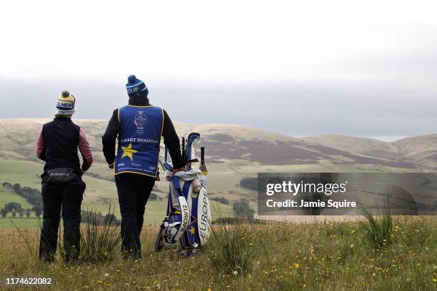 Jodi Ewart Shadoff of Team Europe and her caddy look over the course at the fourth hole during Day 2 of the Solheim Cup at Gleneagles on September...