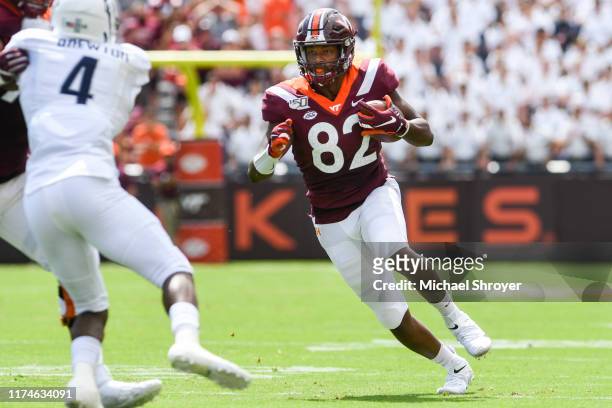 Tight end James Mitchell of the Virginia Tech Hokies carries the ball following a reception against the Old Dominion Monarchs in the first half at...