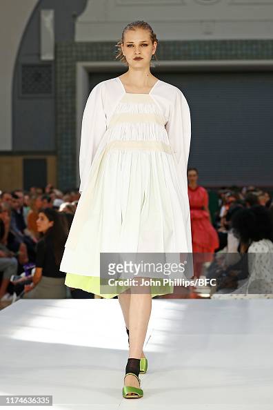 A model walks the runway at the Molly Goddard show during London ...