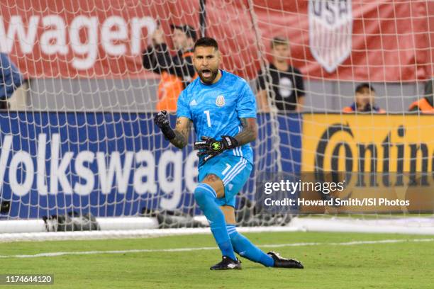 Goalkeeper Jonathan Orozco of Mexico celebrates making a save on a penalty kick during a game between Mexico and USMNT at MetLife Stadium on...