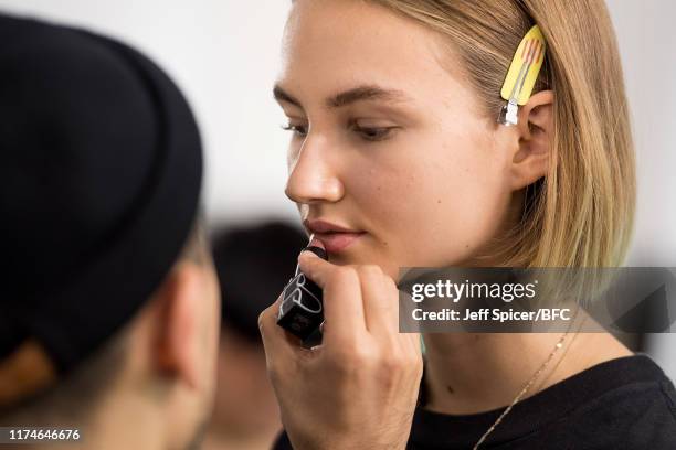 Model backstage ahead of the TOGA show during London Fashion Week September 2019 at RIBA on September 14, 2019 in London, England.