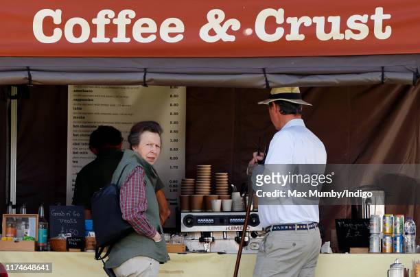 Princess Anne, Princess Royal and husband Sir Tim Laurence queue up at at pop-up coffee shop as they attend day 2 of the Whatley Manor Gatcombe...