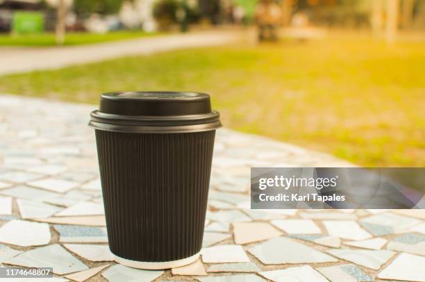 a still life of disposable cup of coffee outdoor - disposable stock pictures, royalty-free photos & images
