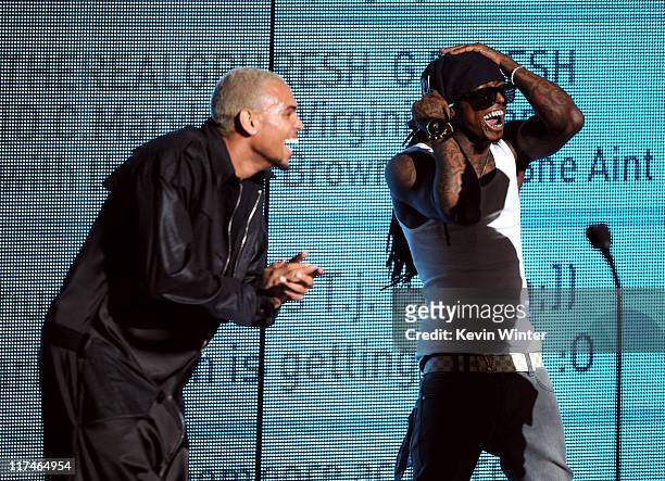 Singer Chris Brown and rapper Lil Wayne accept the Best Collaboration award onstage during the BET Awards '11 held at the Shrine Auditorium on June...