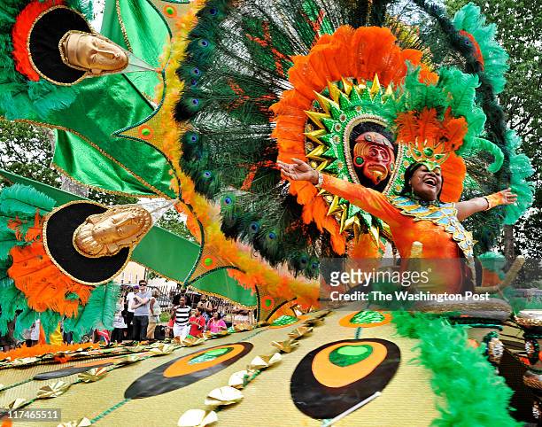 Dorothy Blake, of Berwyn, Md., is resplendent in a huge wheeled costume, representing Trinidad, Tobago, in the 19th annual Caribbean Carnival on June...
