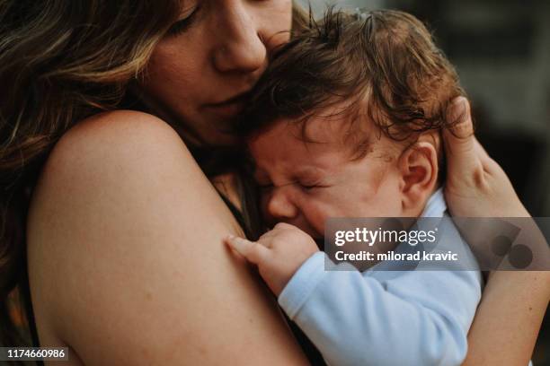 baby cry - tired mother stock pictures, royalty-free photos & images