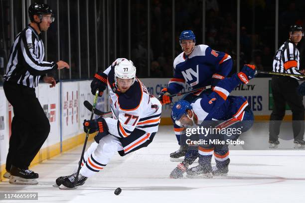 Oscar Klefbom of the Edmonton Oilers skates past Jordan Eberle of the New York Islanders during the third period at NYCB Live's Nassau Coliseum on...