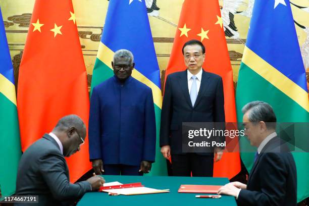 Solomon Islands Prime Minister Manasseh Sogavare, Solomon Islands Foreign Minister Jeremiah Manele, Chinese Premier Li Keqiang and Chinese State...