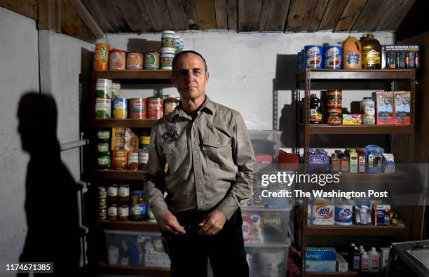 Drew Miller inside a well-stocked fortified bunker that's still under construction on August 23, 2019. Miller, a retired Air Force intelligence...