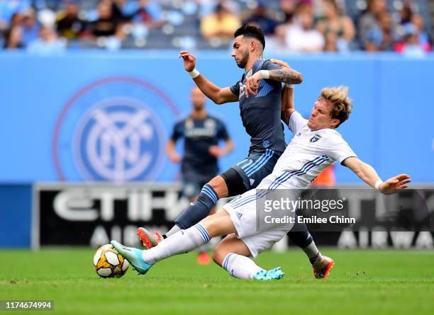 Valentin Castellanos of New York City FC and Florian Jungwirth of San Jose fight for the ball during their game at Yankee Stadium on September 14,...