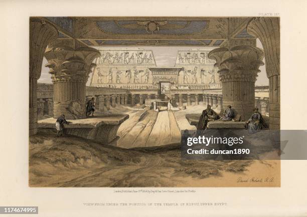 under the portico of the temple of edfu, upper egypt - ancient-egyptian-culture stock illustrations