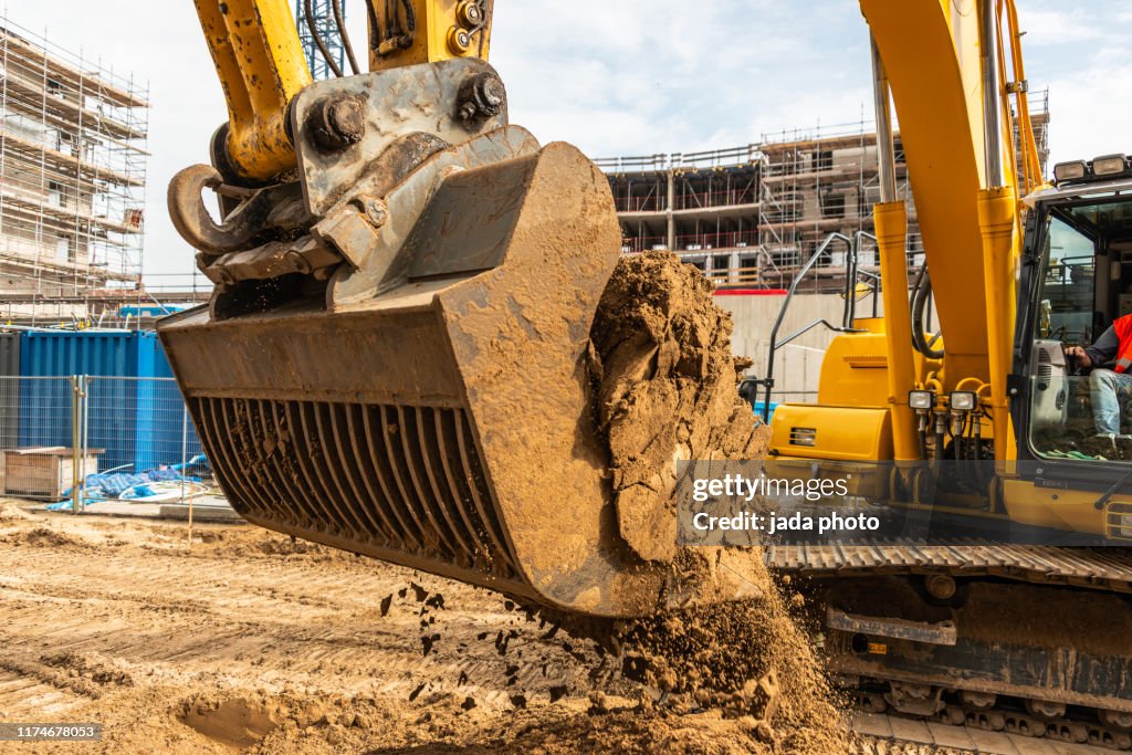 Industrial earth mover scoops up a huge amount of sand