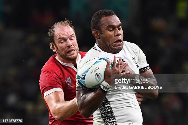 Wales' lock Alun Wyn Jones and Fiji's lock Leone Nakarawa fight for the ball in a line out during the Japan 2019 Rugby World Cup Pool D match between...