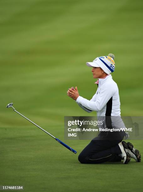 Azahara Munoz of Team Europe reacts to her missed putt on the ninth hole during Day 2 of the Solheim Cup at Gleneagles on September 14, 2019 in...